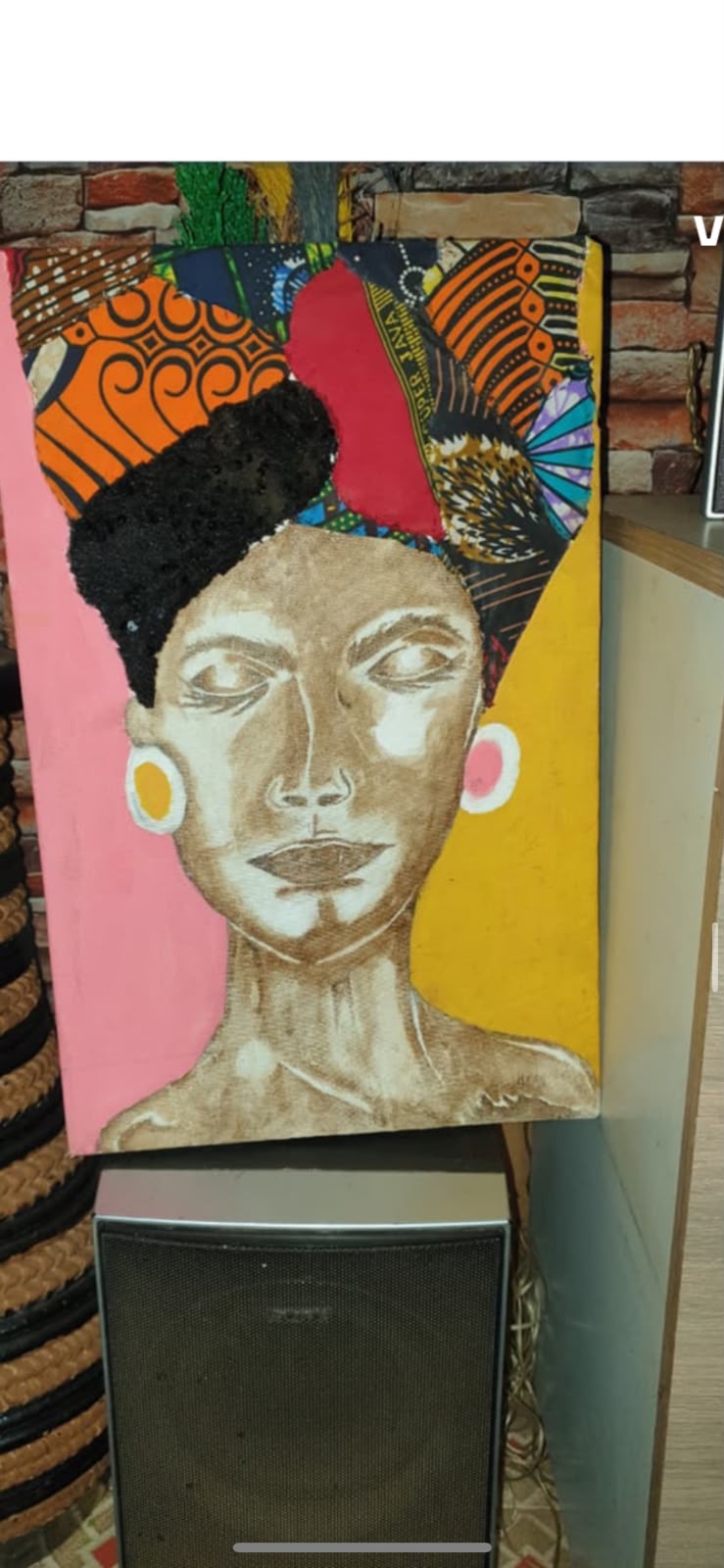 Painted portrait with an Ankara headwrap in orange, red and blue